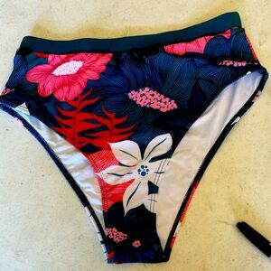 New bathing suit bottom, Size Lg multi color. Panty sticker still attached.
